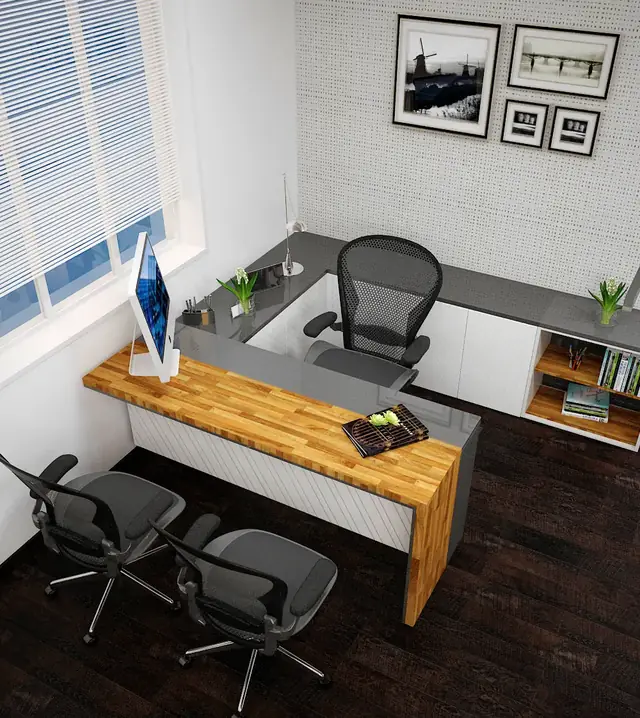 Private cabin with butcher-block desk, framed art and dark wood floor