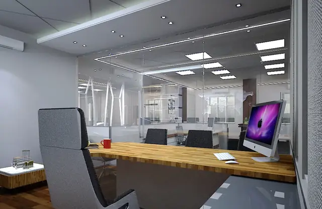 Glass-partitioned cabin overlooking the workstation area