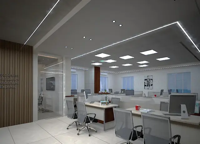 Workstation bay with fluted wood wall and linear lighting